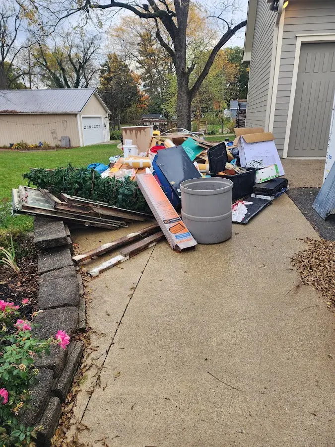 Dumpster being loaded with debris for 3 Yard Dumpster Rental in New Ipswich